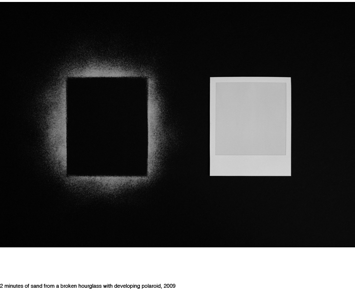 2 minutes of sand from an hourglass with developing polaroid, 2009, JOHN SISLEY
